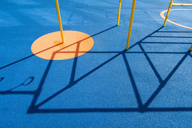 Certified playground safety inspector testing surface impact attenuation with a drop test device